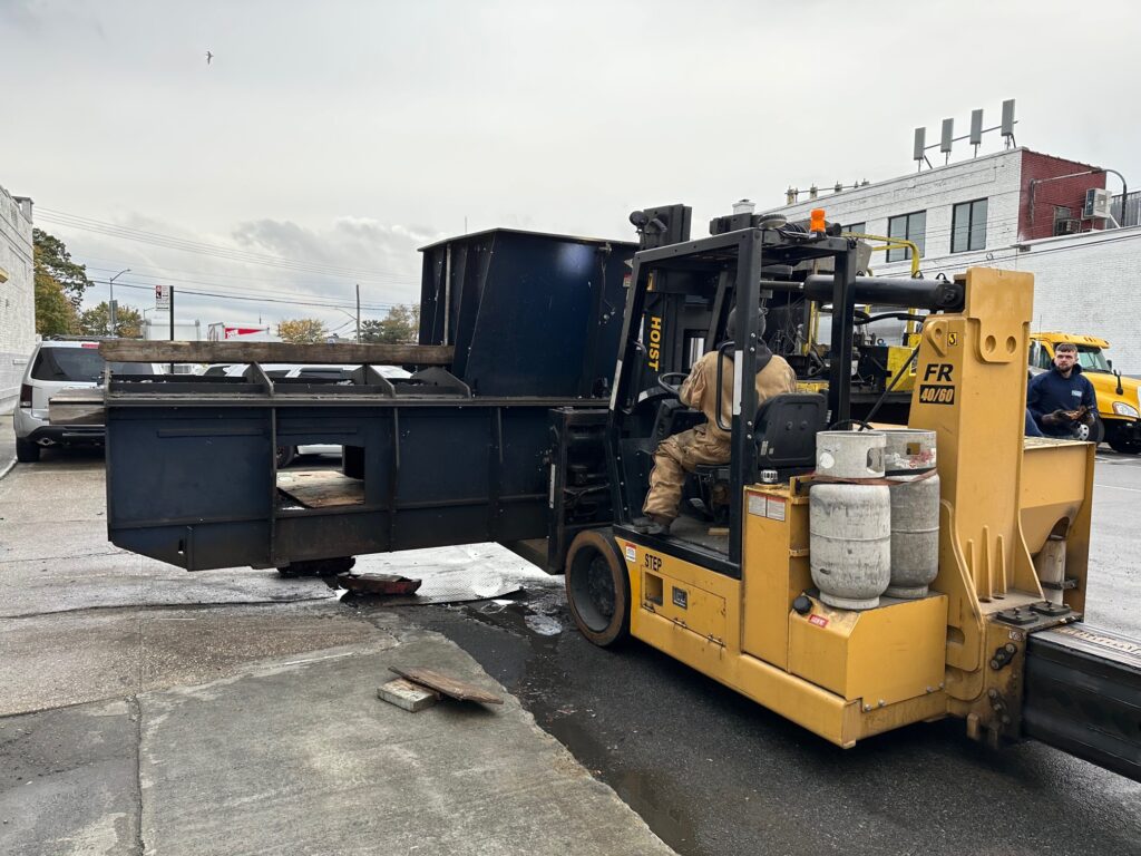 Moving a Large Two-Ram Baler to a New Location - On Forklift